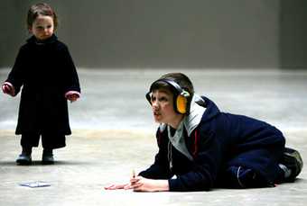 Kid wearing headphones doing the Making your Mark activity at Tate Modern